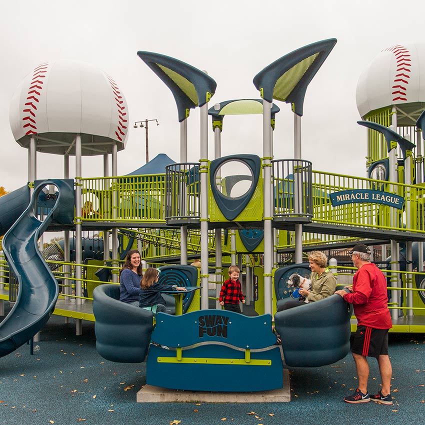 a family playing in a park